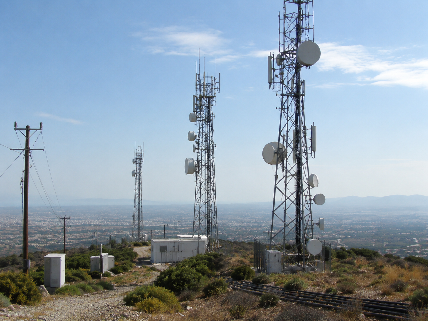 Telecommunications network towers at dusk